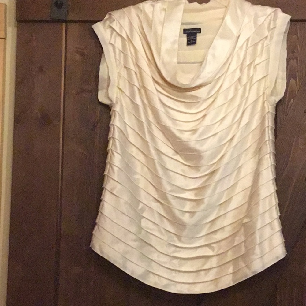 Cream silk blouse.